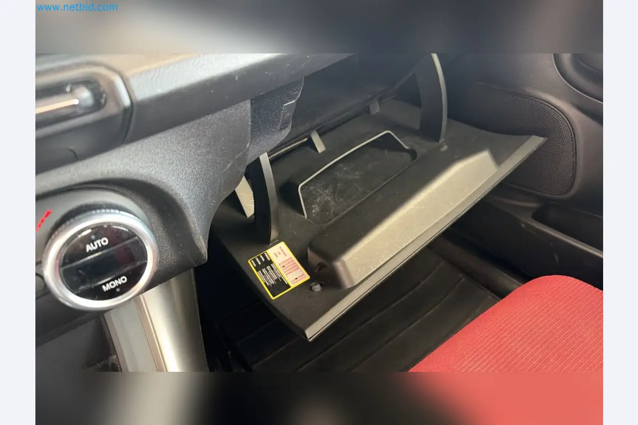 Passenger cars, electric cars, and automotive repair shop equipment at a Fiat dealership-9