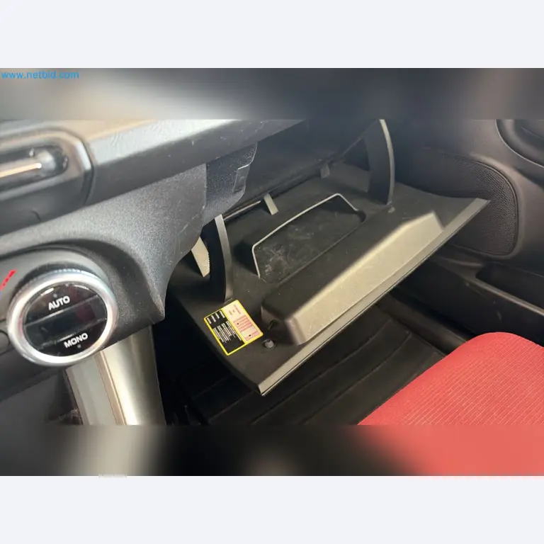 Passenger cars, electric cars, and automotive repair shop equipment at a Fiat dealership-9