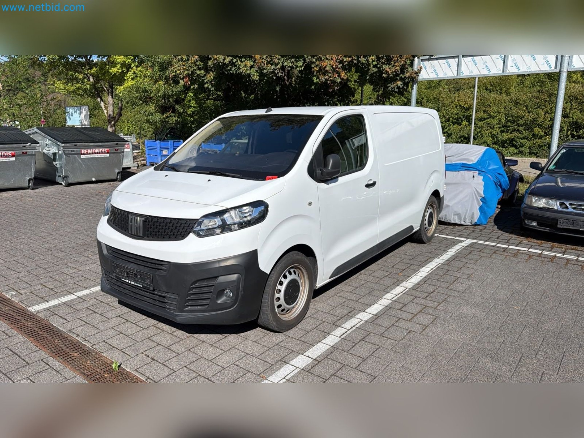 Passenger cars, electric cars, and automotive repair shop equipment at a Fiat dealership-1