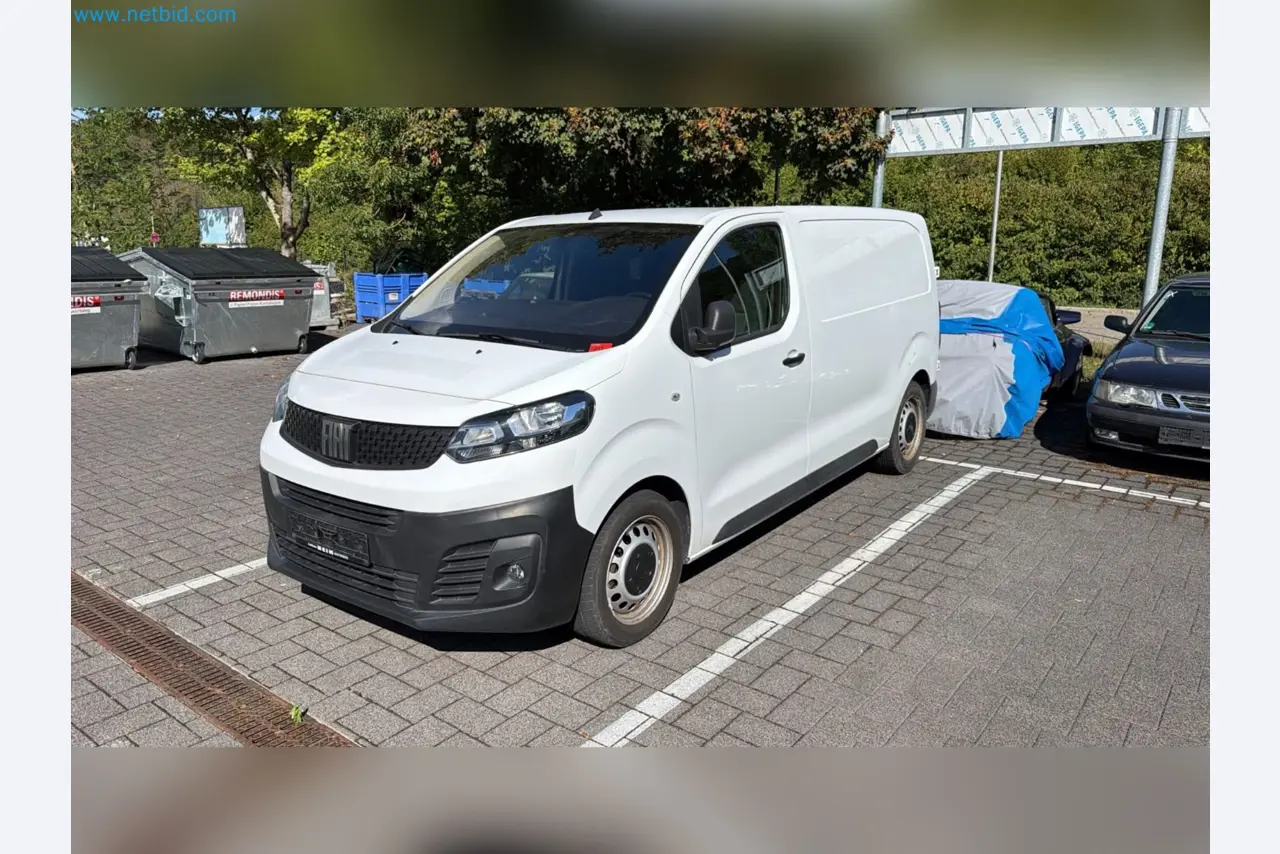 Passenger cars, electric cars, and automotive repair shop equipment at a Fiat dealership-1