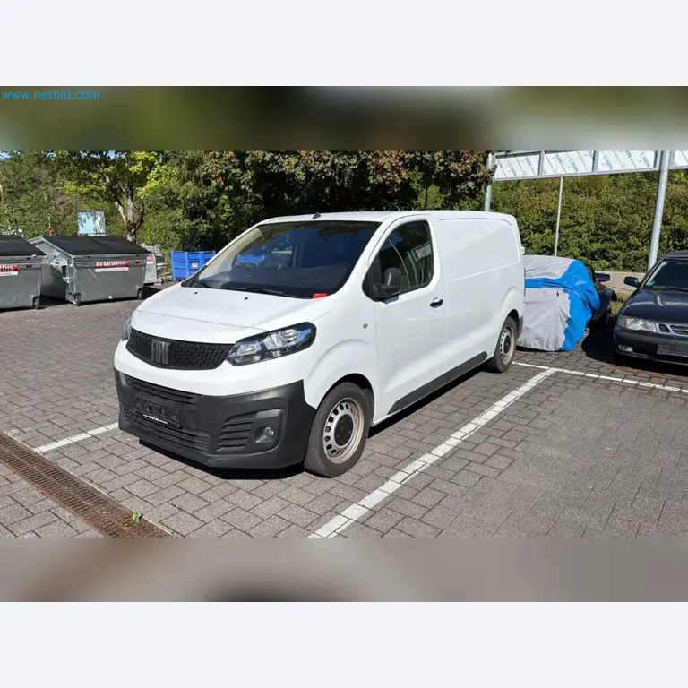 Passenger cars, electric cars, and automotive repair shop equipment at a Fiat dealership-1