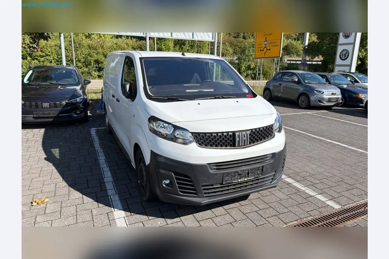 Passenger cars, electric cars, and automotive repair shop equipment at a Fiat dealership-2