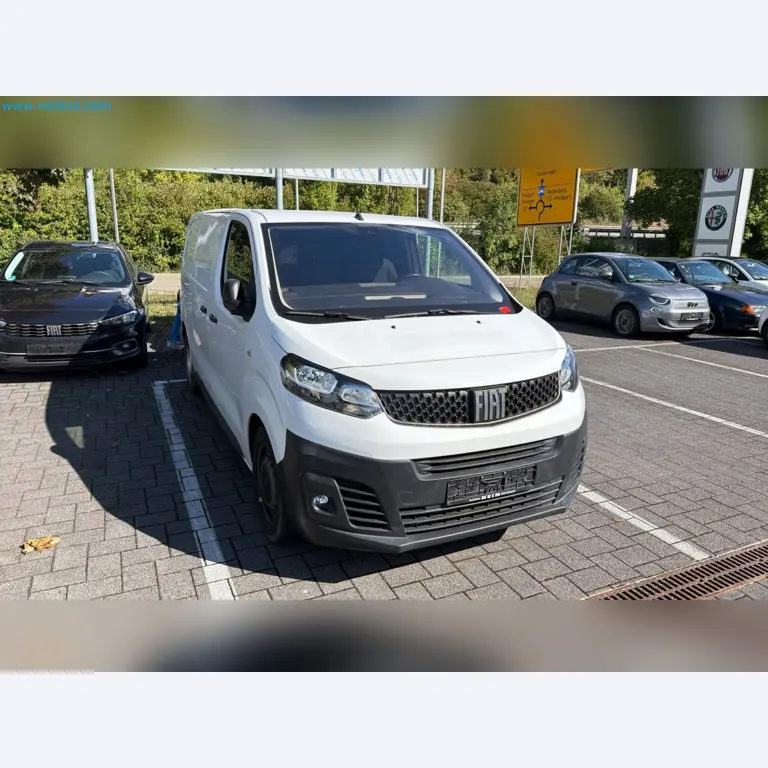 Passenger cars, electric cars, and automotive repair shop equipment at a Fiat dealership-2