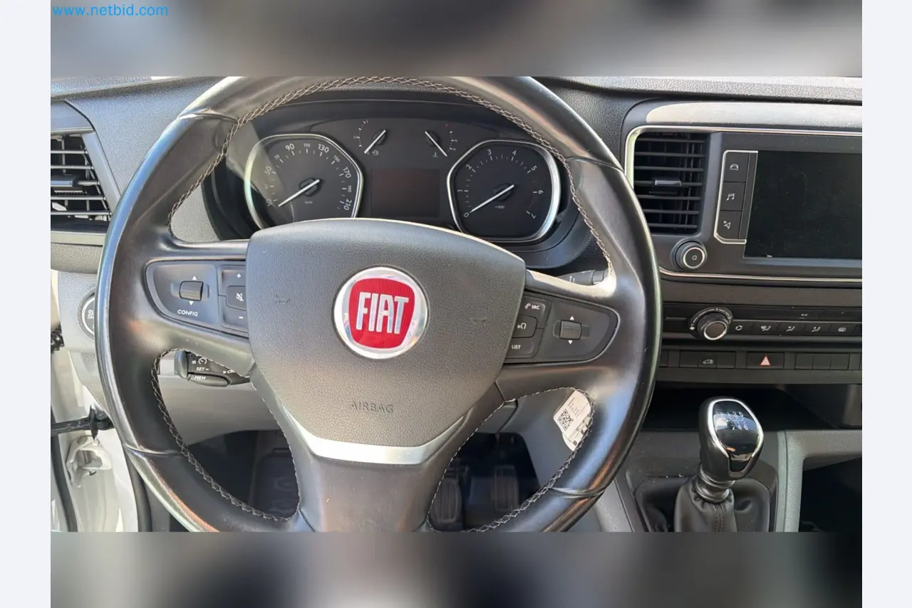 Passenger cars, electric cars, and automotive repair shop equipment at a Fiat dealership-4
