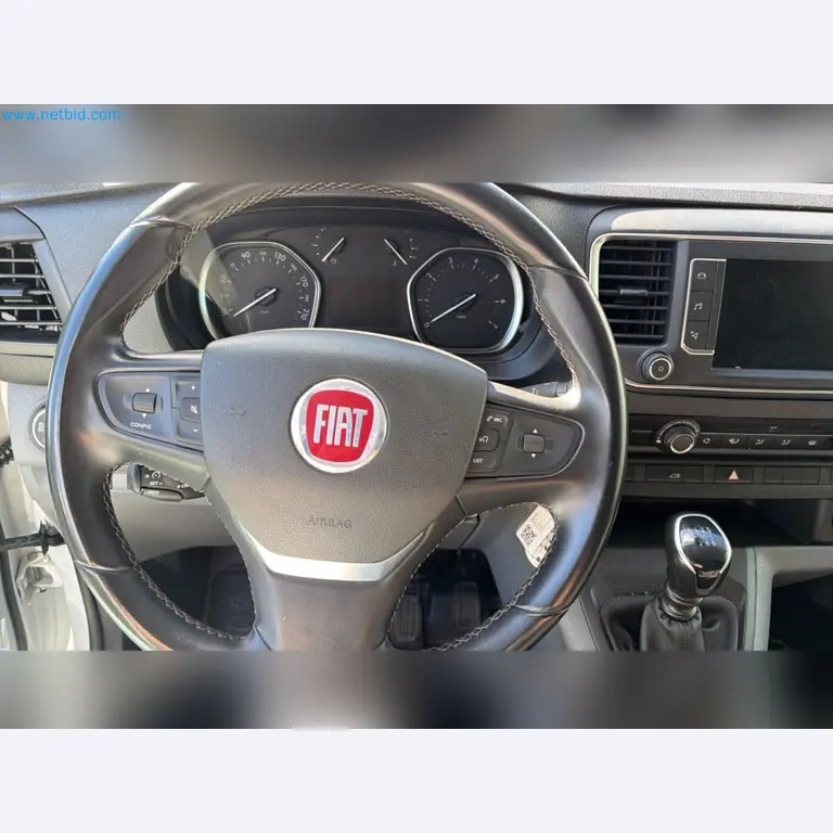 Passenger cars, electric cars, and automotive repair shop equipment at a Fiat dealership-4