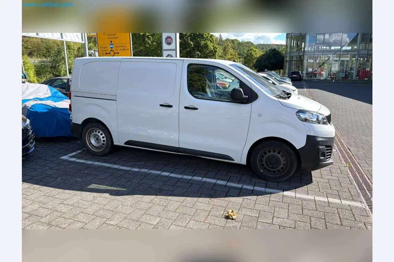 Passenger cars, electric cars, and automotive repair shop equipment at a Fiat dealership-6
