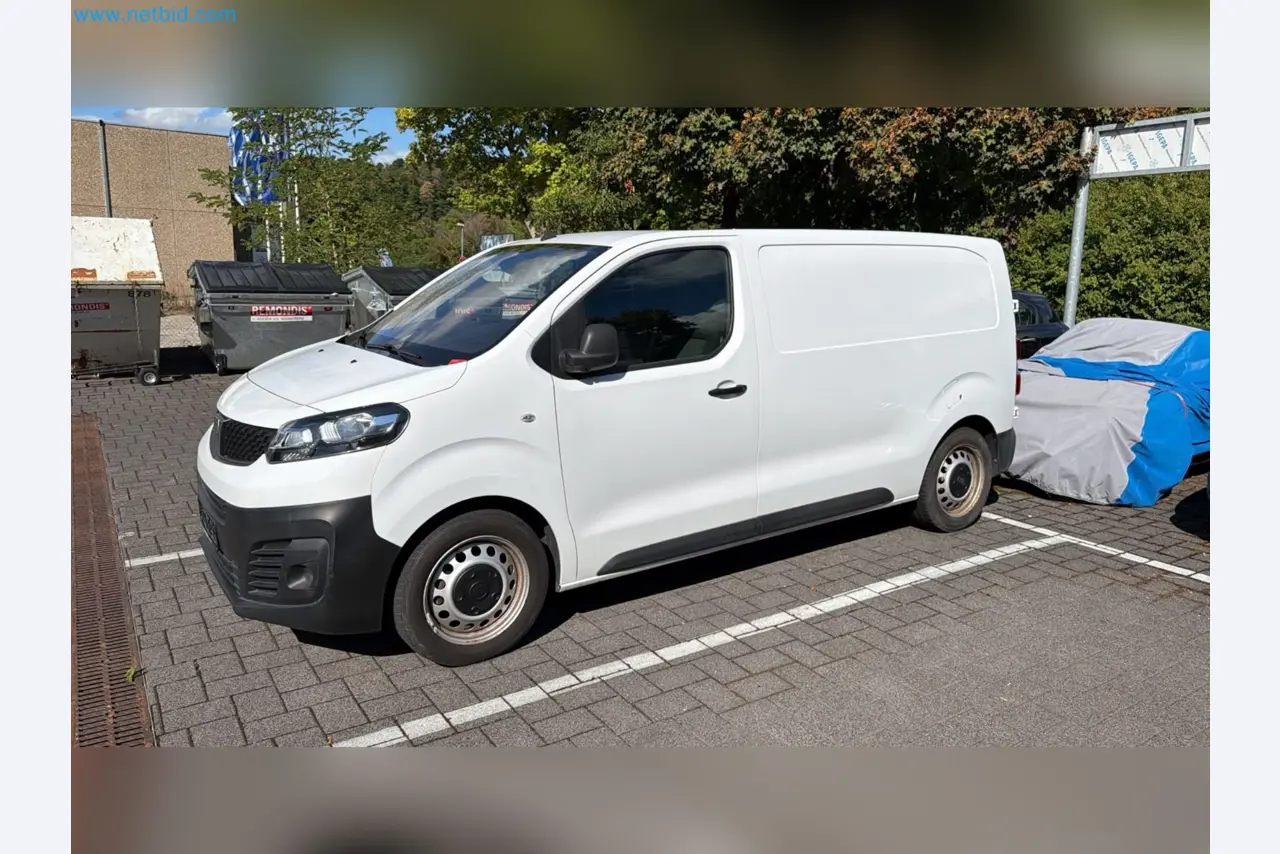Passenger cars, electric cars, and automotive repair shop equipment at a Fiat dealership-7