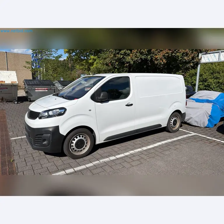 Passenger cars, electric cars, and automotive repair shop equipment at a Fiat dealership-7
