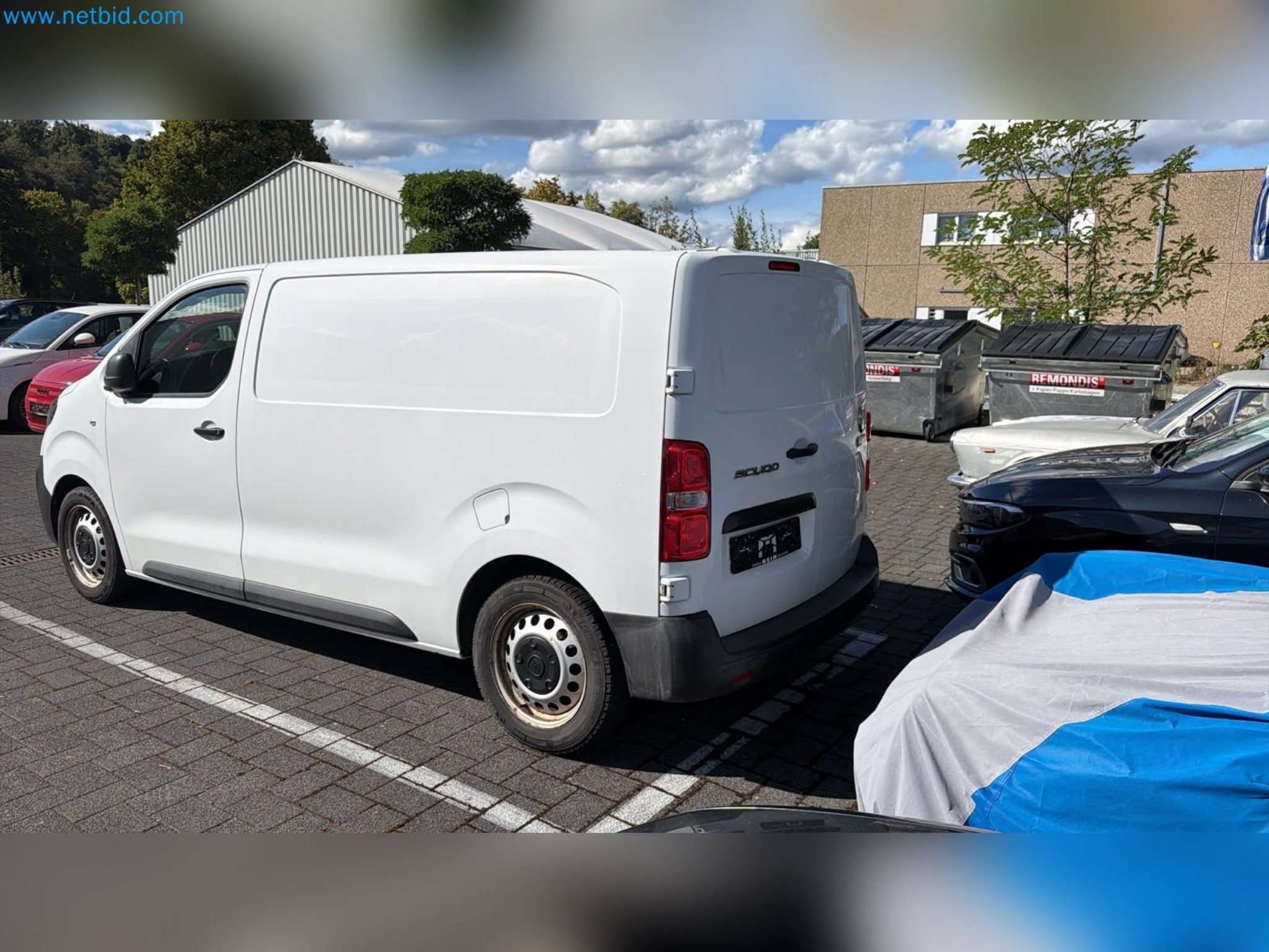 Passenger cars, electric cars, and automotive repair shop equipment at a Fiat dealership-8