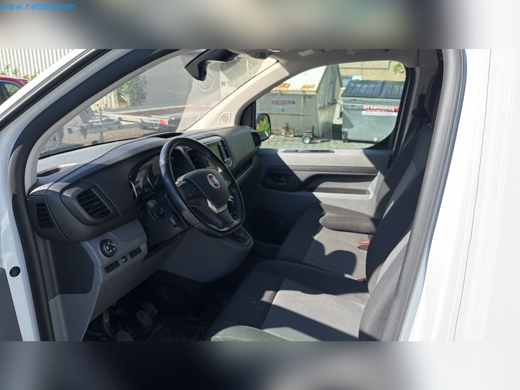 Passenger cars, electric cars, and automotive repair shop equipment at a Fiat dealership-9