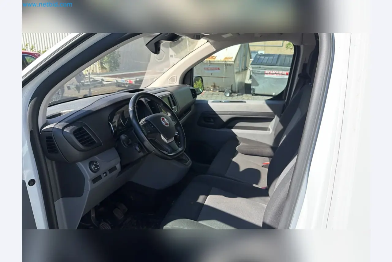 Passenger cars, electric cars, and automotive repair shop equipment at a Fiat dealership-9