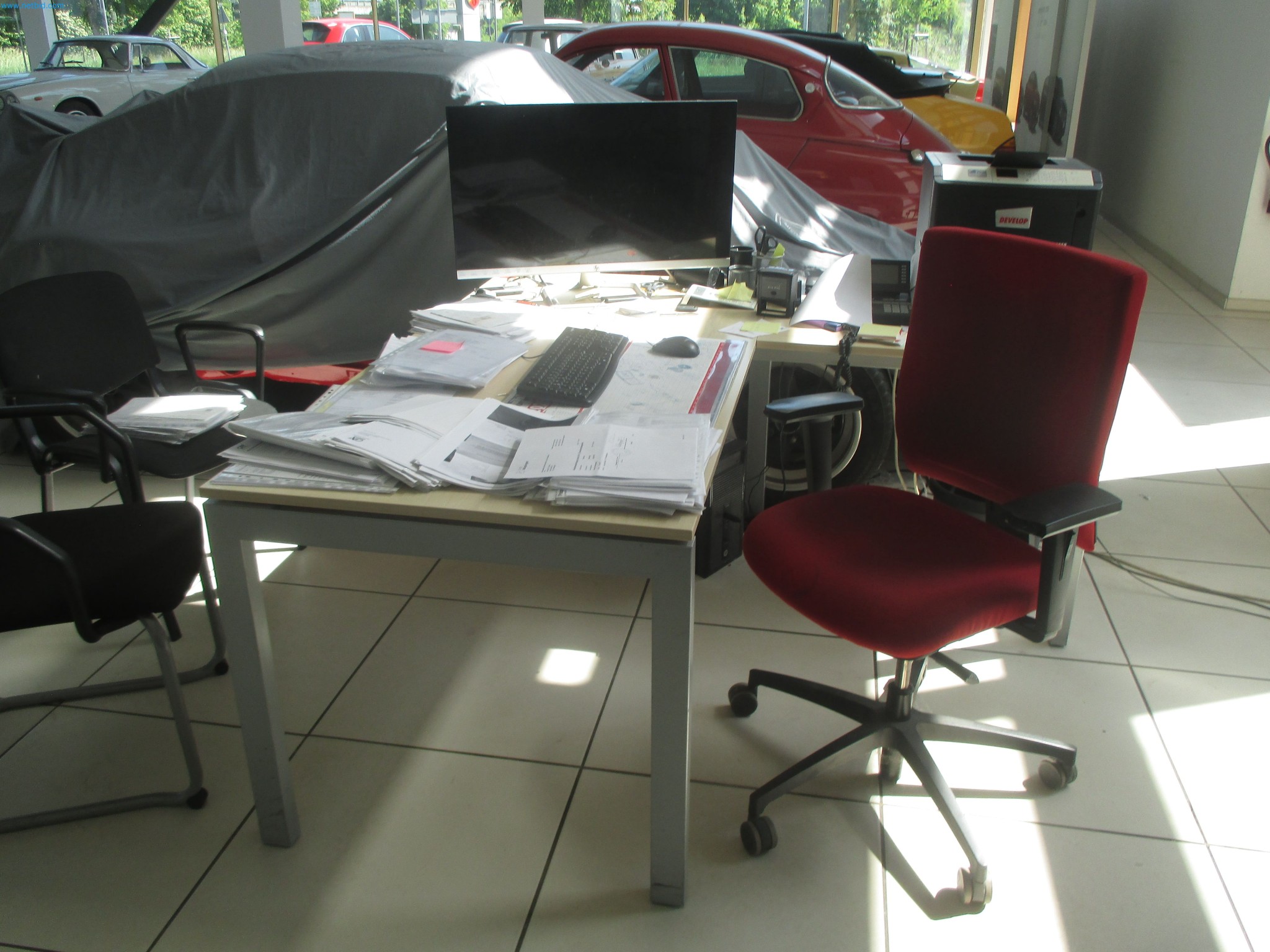 Passenger cars, electric cars, and automotive repair shop equipment at a Fiat dealership-3