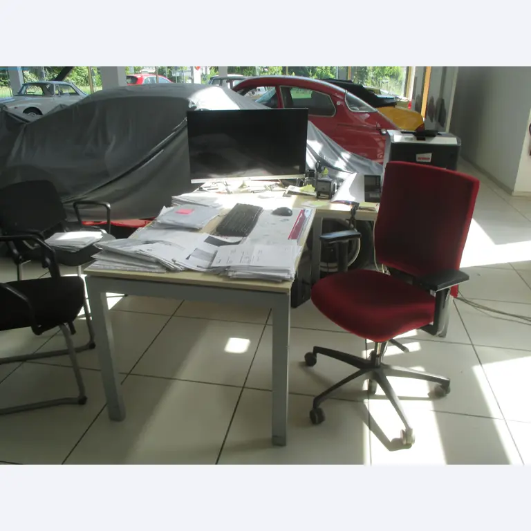 Passenger cars, electric cars, and automotive repair shop equipment at a Fiat dealership-3
