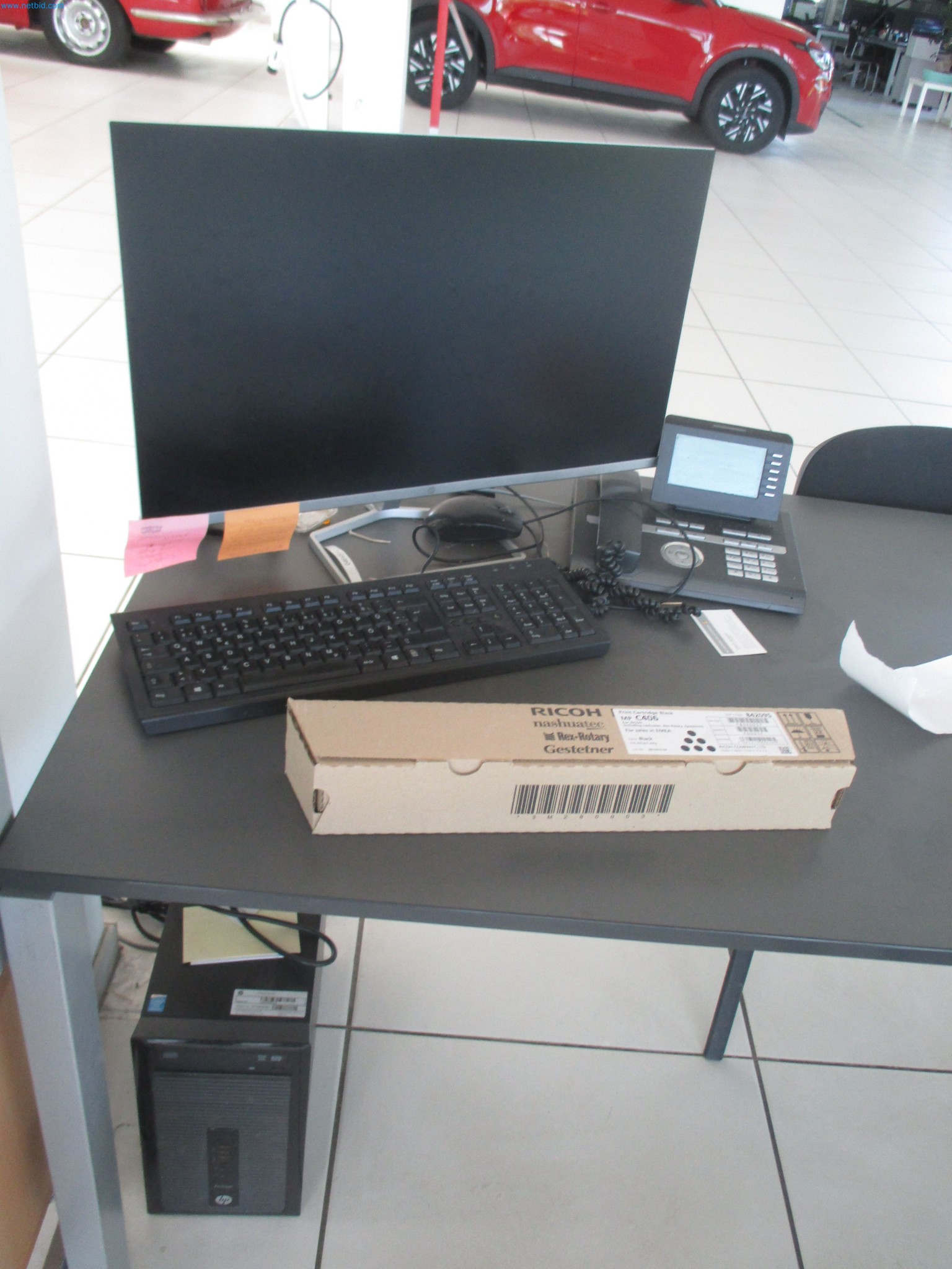 Passenger cars, electric cars, and automotive repair shop equipment at a Fiat dealership-1