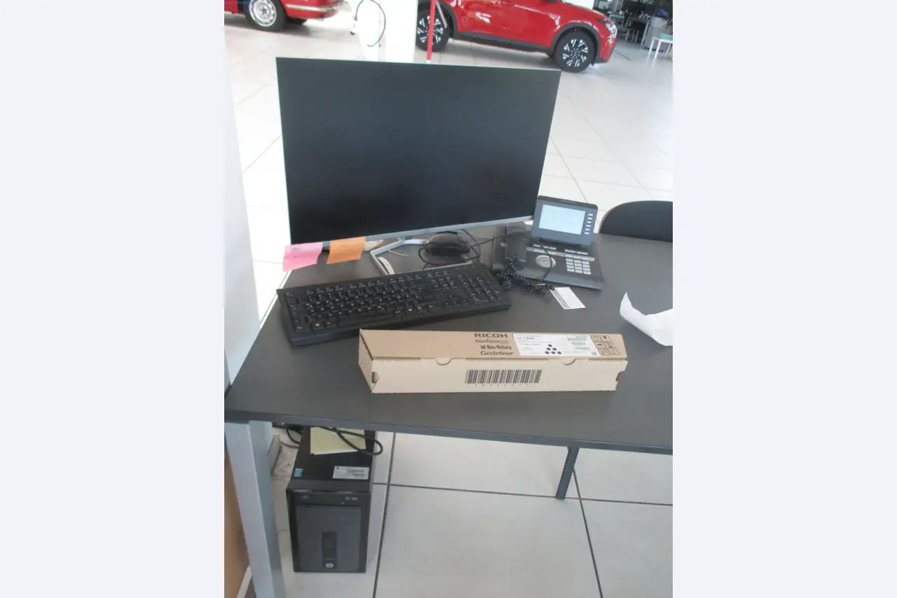 Passenger cars, electric cars, and automotive repair shop equipment at a Fiat dealership-1