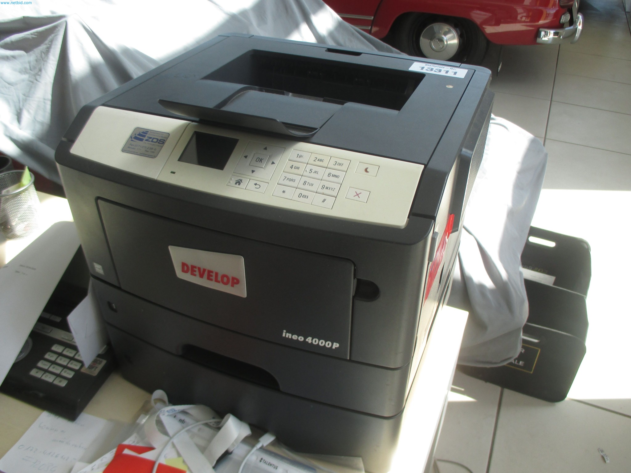 Passenger cars, electric cars, and automotive repair shop equipment at a Fiat dealership-1