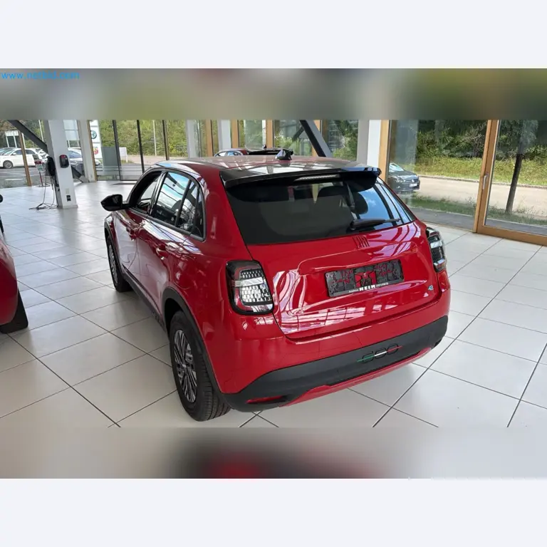 Passenger cars, electric cars, and automotive repair shop equipment at a Fiat dealership-10