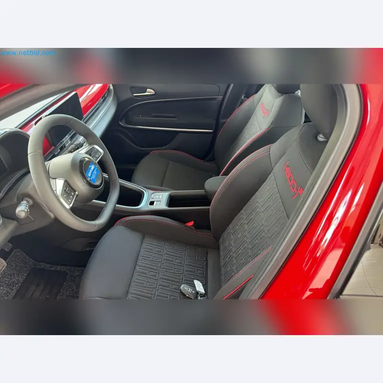 Passenger cars, electric cars, and automotive repair shop equipment at a Fiat dealership-11