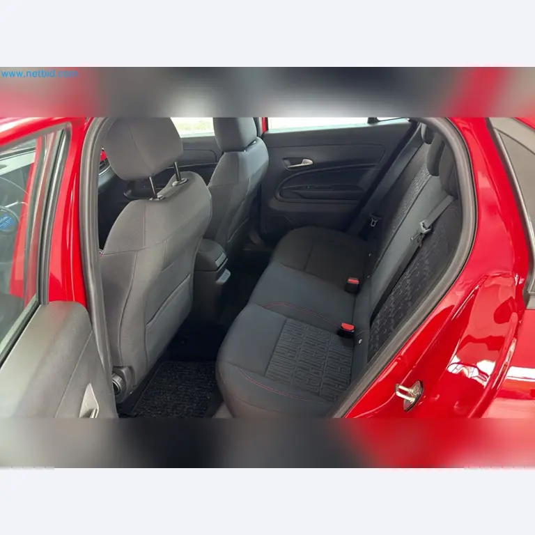 Passenger cars, electric cars, and automotive repair shop equipment at a Fiat dealership-13