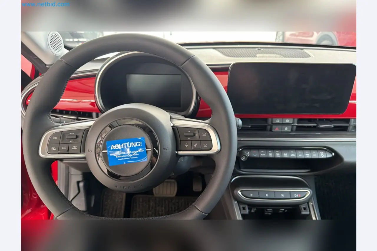 Passenger cars, electric cars, and automotive repair shop equipment at a Fiat dealership-14