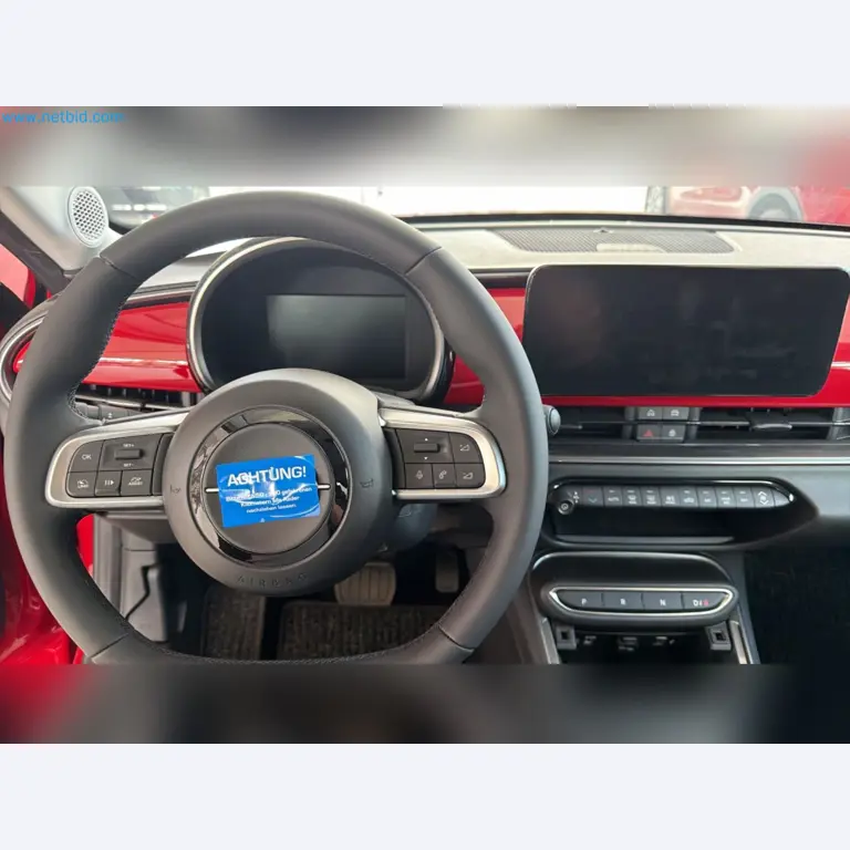 Passenger cars, electric cars, and automotive repair shop equipment at a Fiat dealership-14