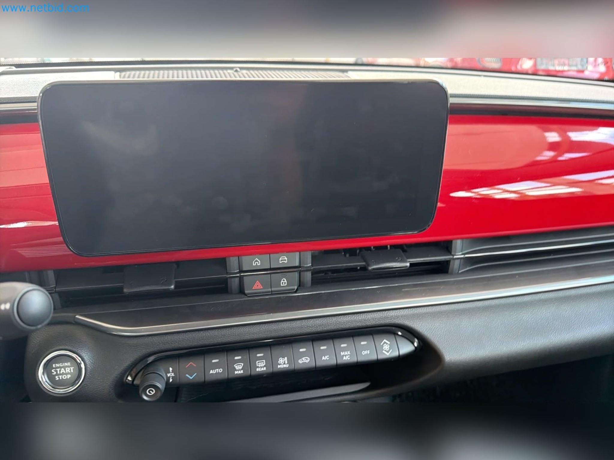 Passenger cars, electric cars, and automotive repair shop equipment at a Fiat dealership-15