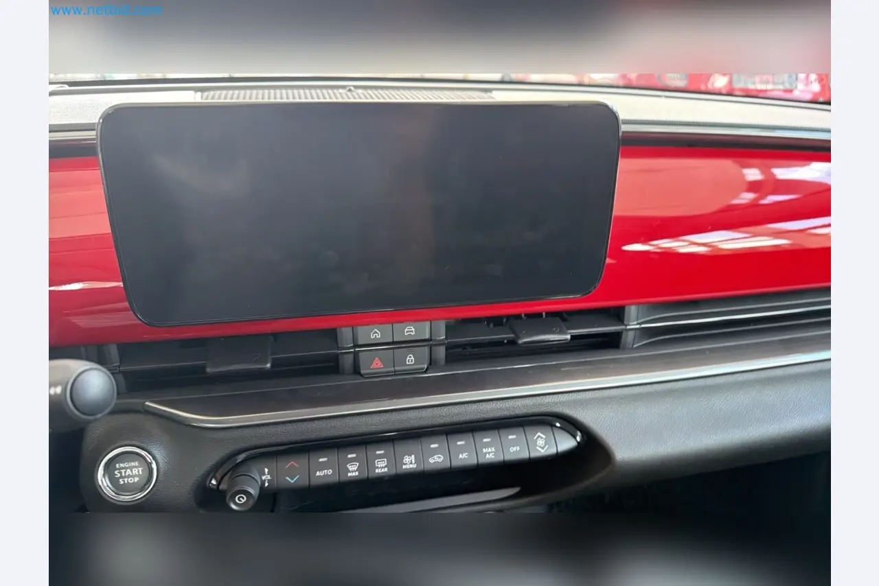 Passenger cars, electric cars, and automotive repair shop equipment at a Fiat dealership-15