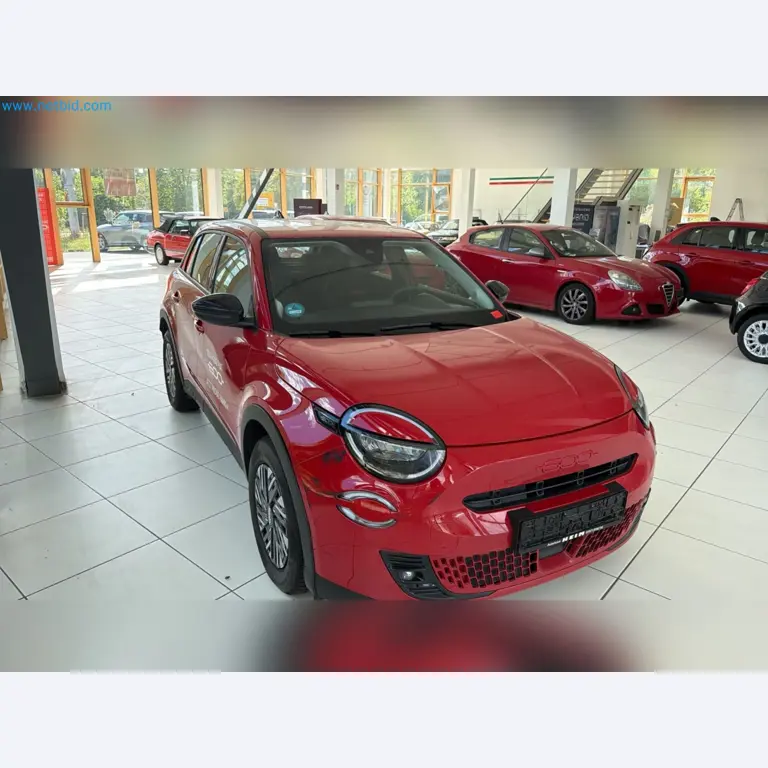 Passenger cars, electric cars, and automotive repair shop equipment at a Fiat dealership-1