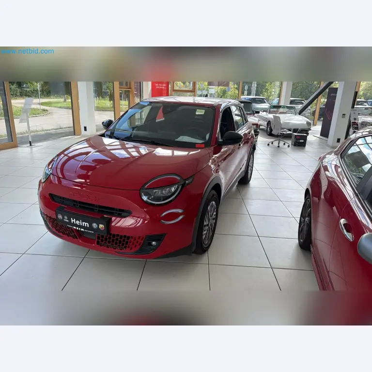 Passenger cars, electric cars, and automotive repair shop equipment at a Fiat dealership-2