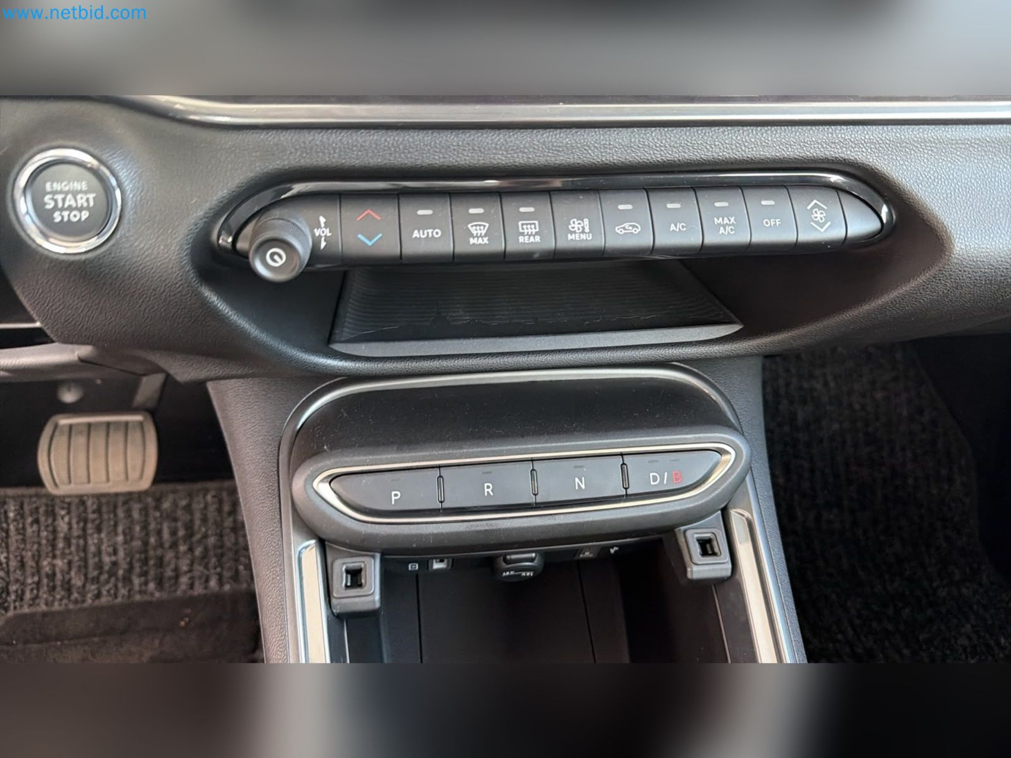 Passenger cars, electric cars, and automotive repair shop equipment at a Fiat dealership-3