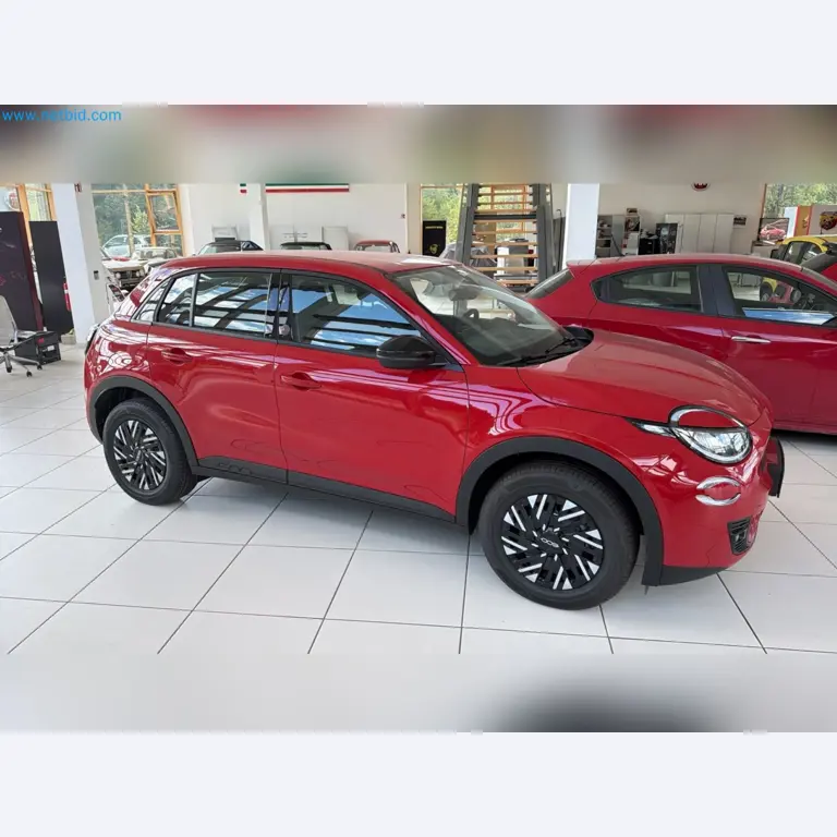 Passenger cars, electric cars, and automotive repair shop equipment at a Fiat dealership-8