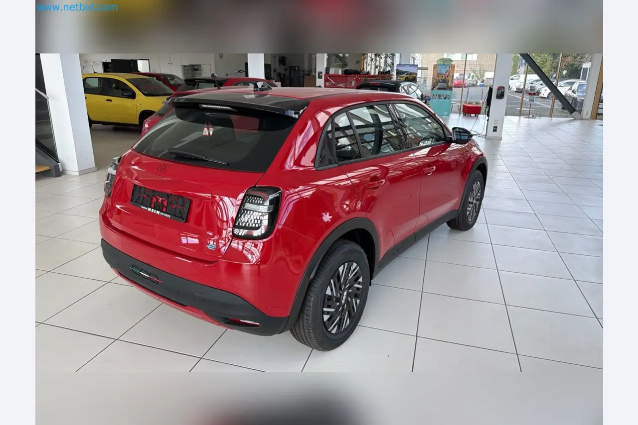Passenger cars, electric cars, and automotive repair shop equipment at a Fiat dealership-9
