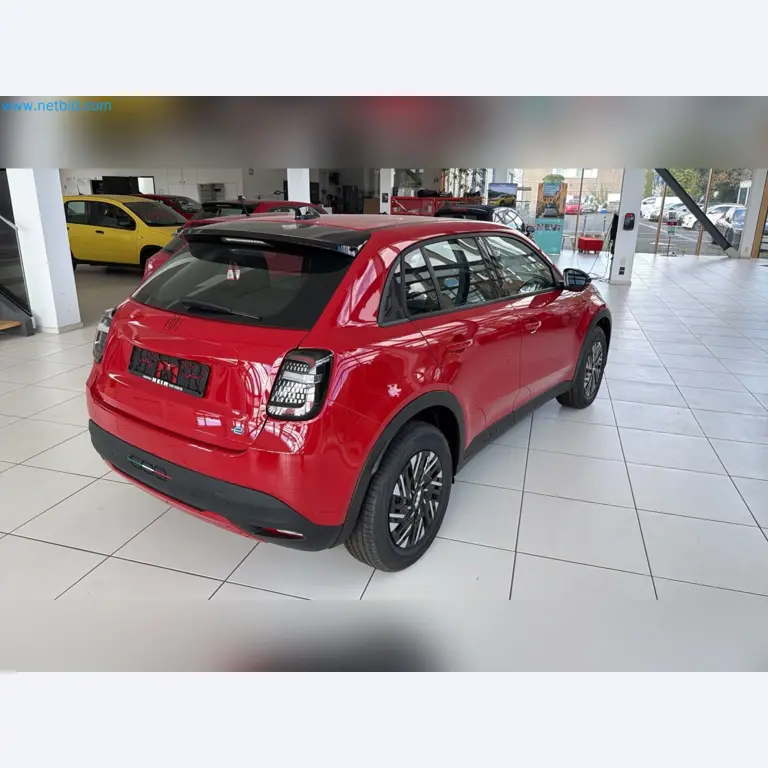 Passenger cars, electric cars, and automotive repair shop equipment at a Fiat dealership-9