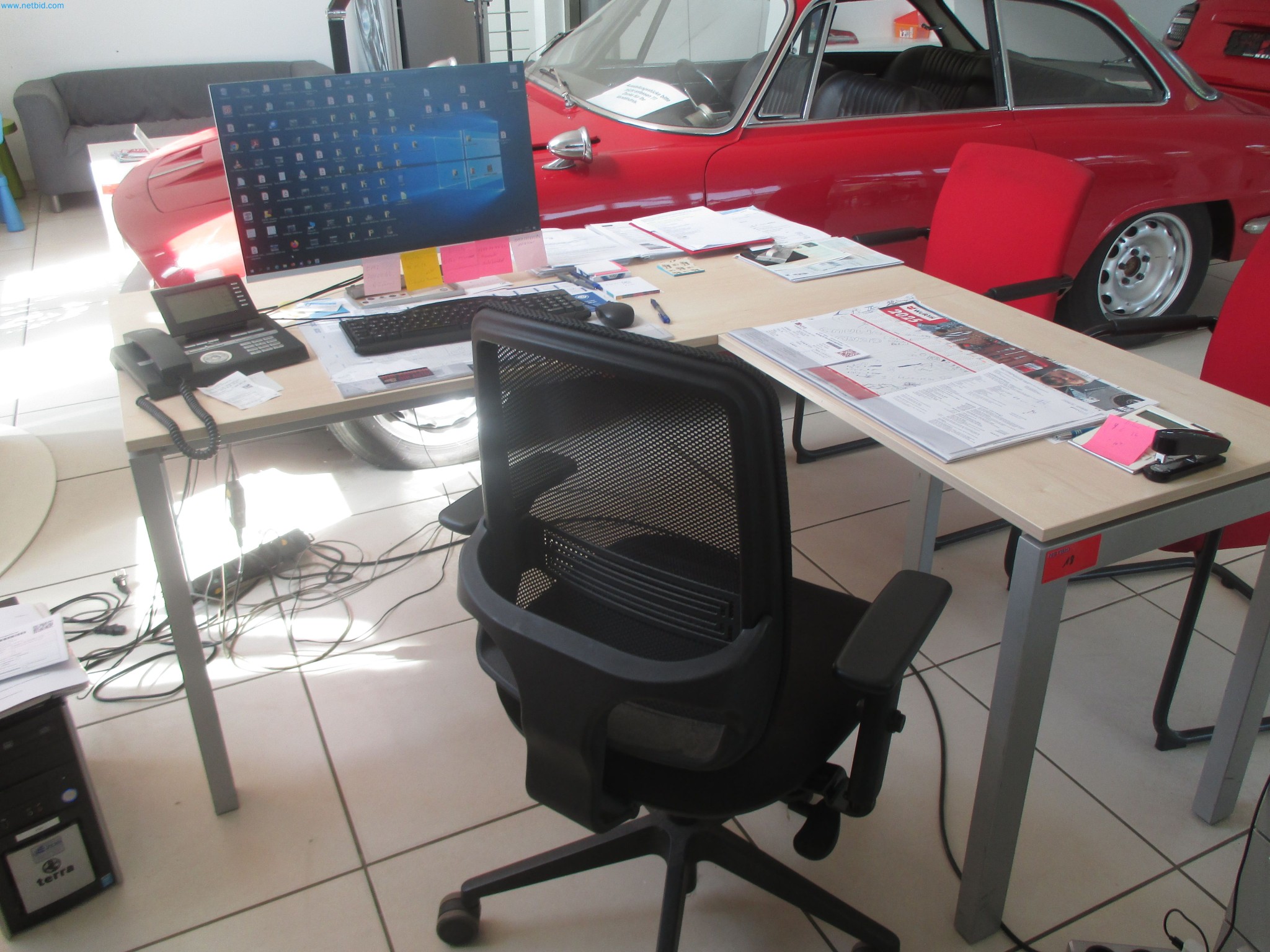 Passenger cars, electric cars, and automotive repair shop equipment at a Fiat dealership-1