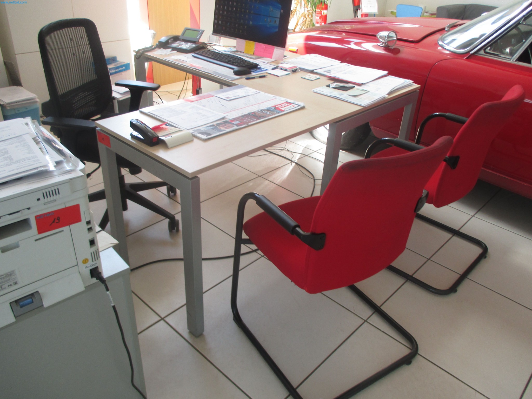 Passenger cars, electric cars, and automotive repair shop equipment at a Fiat dealership-2