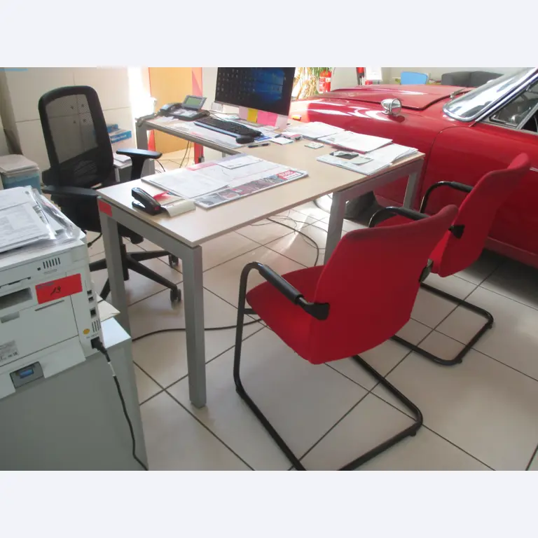 Passenger cars, electric cars, and automotive repair shop equipment at a Fiat dealership-2