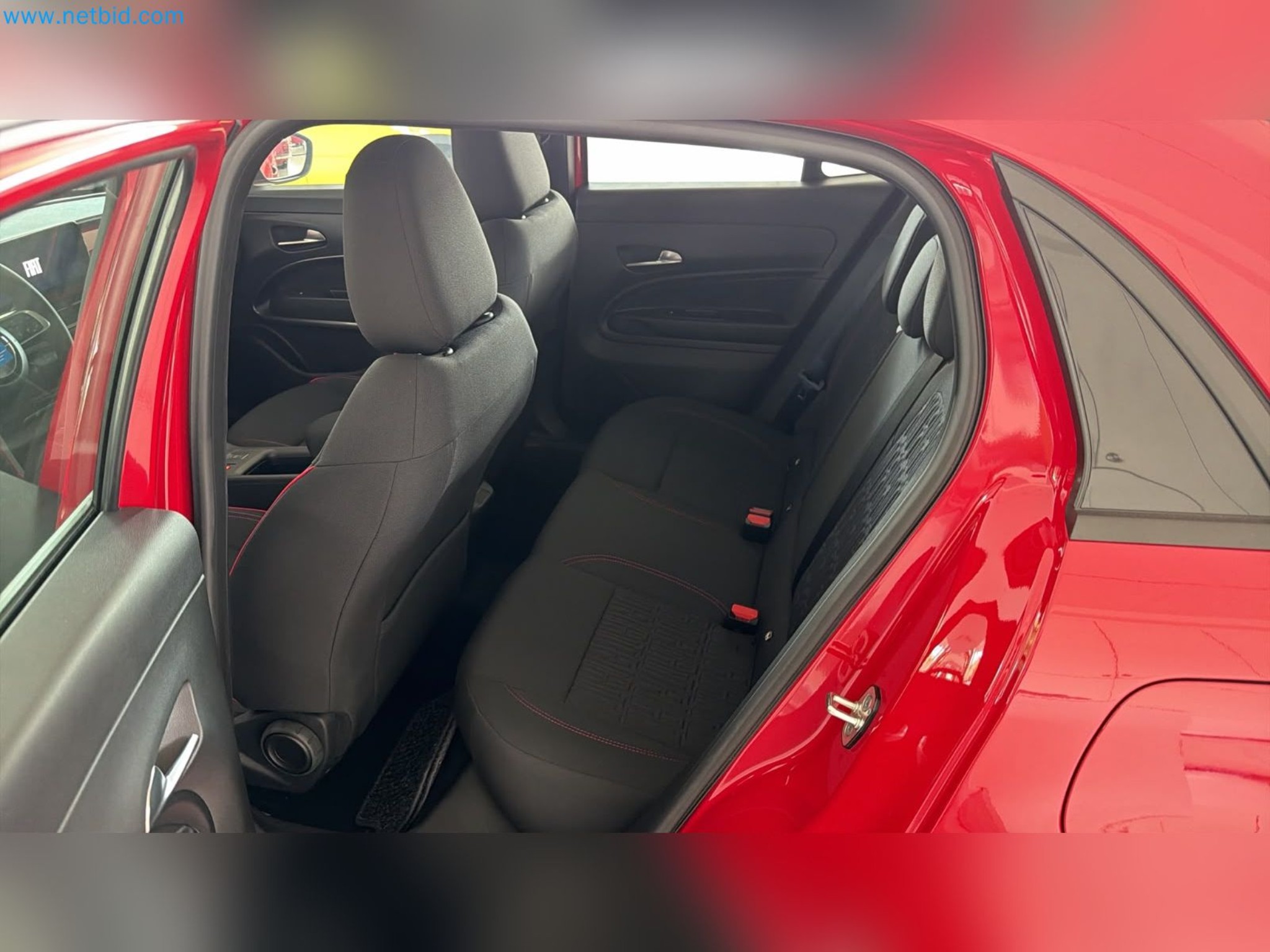 Passenger cars, electric cars, and automotive repair shop equipment at a Fiat dealership-10