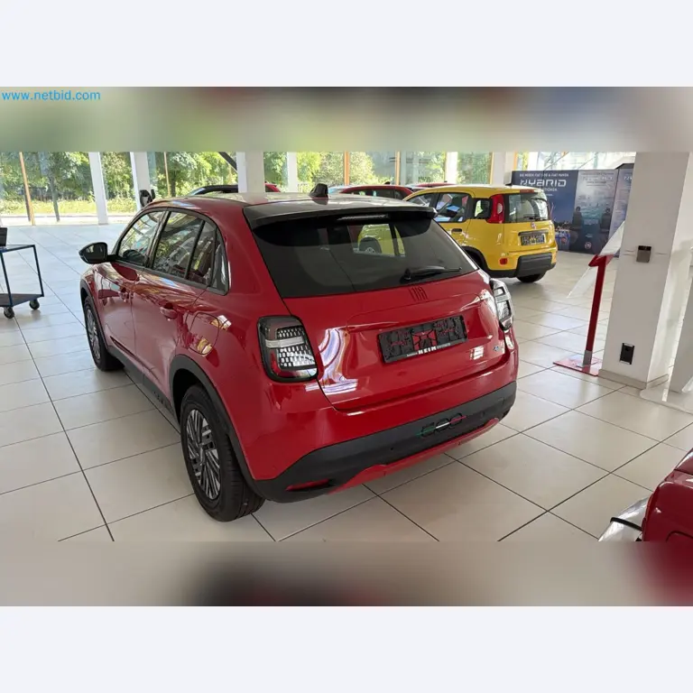 Passenger cars, electric cars, and automotive repair shop equipment at a Fiat dealership-11