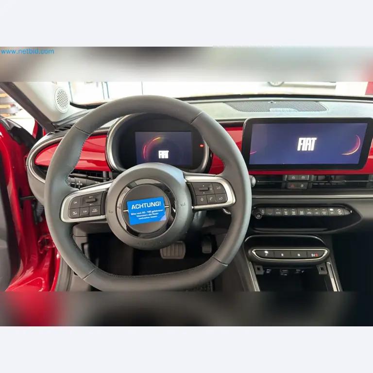 Passenger cars, electric cars, and automotive repair shop equipment at a Fiat dealership-12