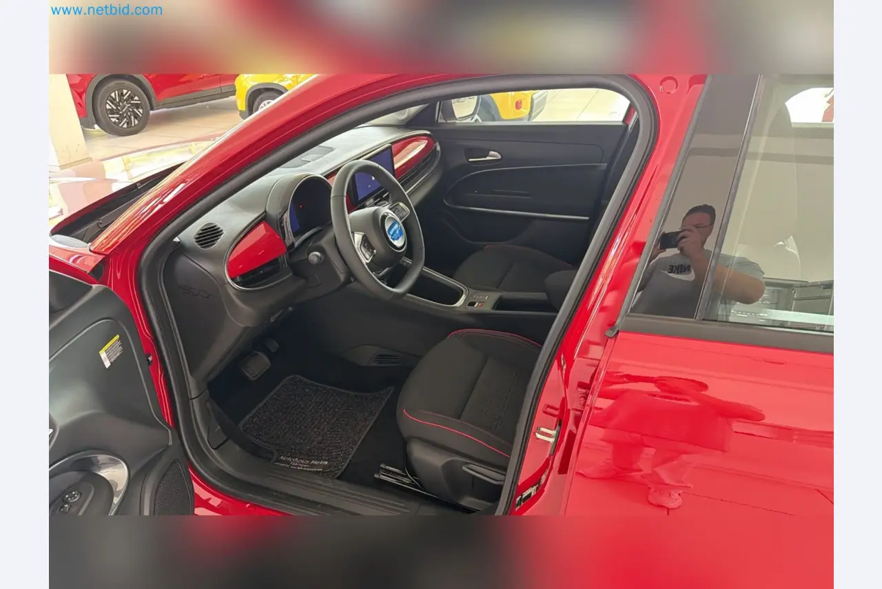 Passenger cars, electric cars, and automotive repair shop equipment at a Fiat dealership-13