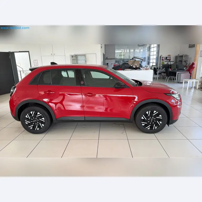 Passenger cars, electric cars, and automotive repair shop equipment at a Fiat dealership-2