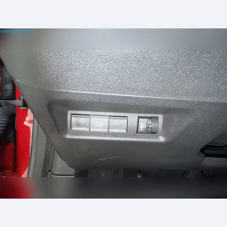 Passenger cars, electric cars, and automotive repair shop equipment at a Fiat dealership-6