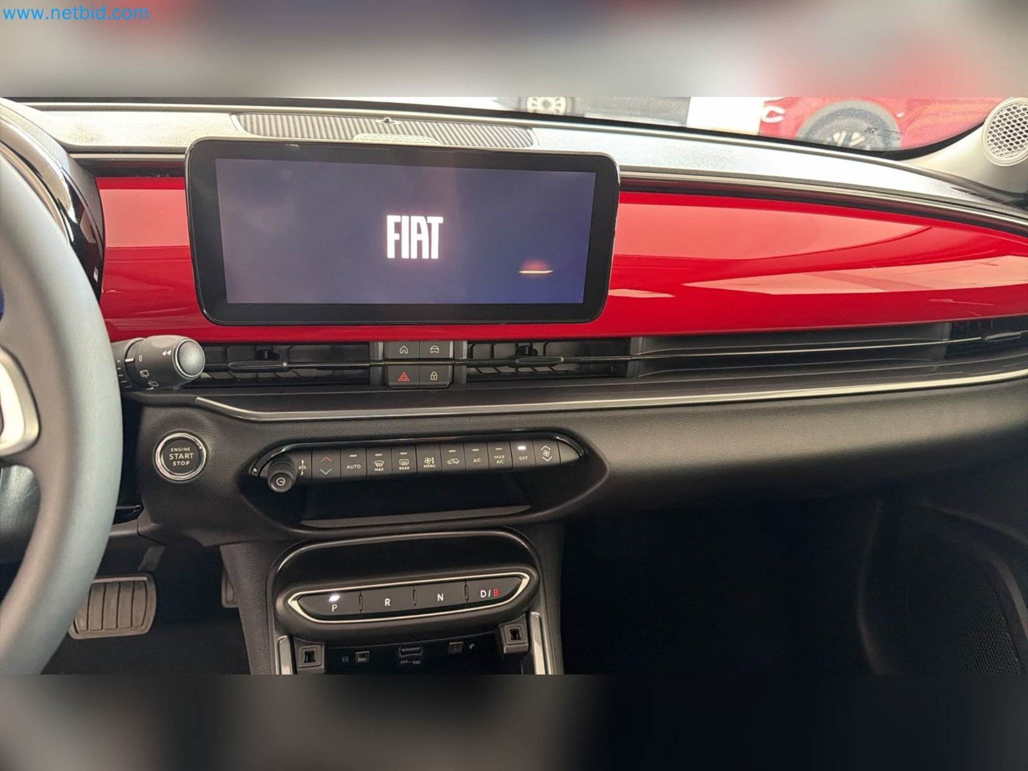 Passenger cars, electric cars, and automotive repair shop equipment at a Fiat dealership-7