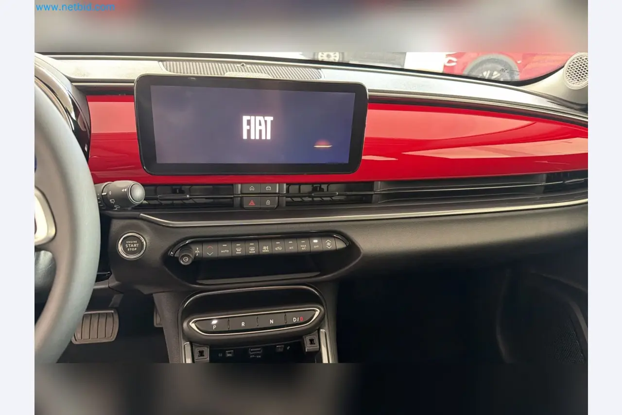 Passenger cars, electric cars, and automotive repair shop equipment at a Fiat dealership-7