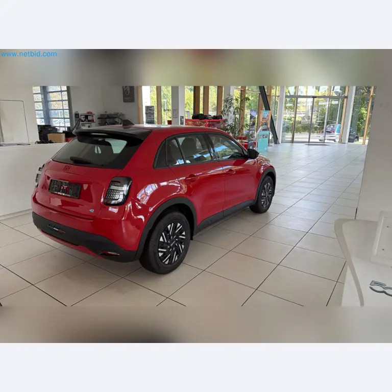 Passenger cars, electric cars, and automotive repair shop equipment at a Fiat dealership-9