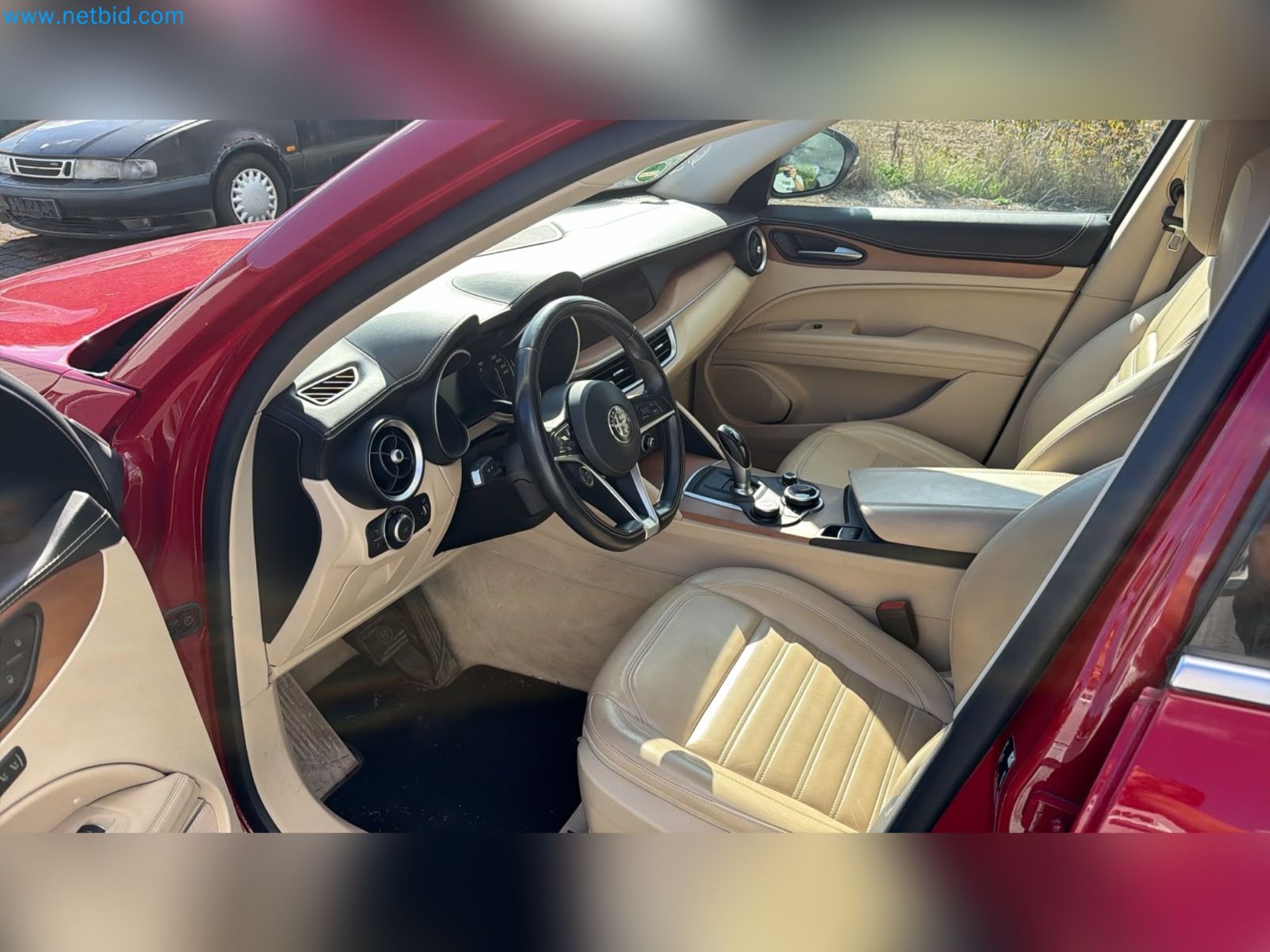Passenger cars, electric cars, and automotive repair shop equipment at a Fiat dealership-10