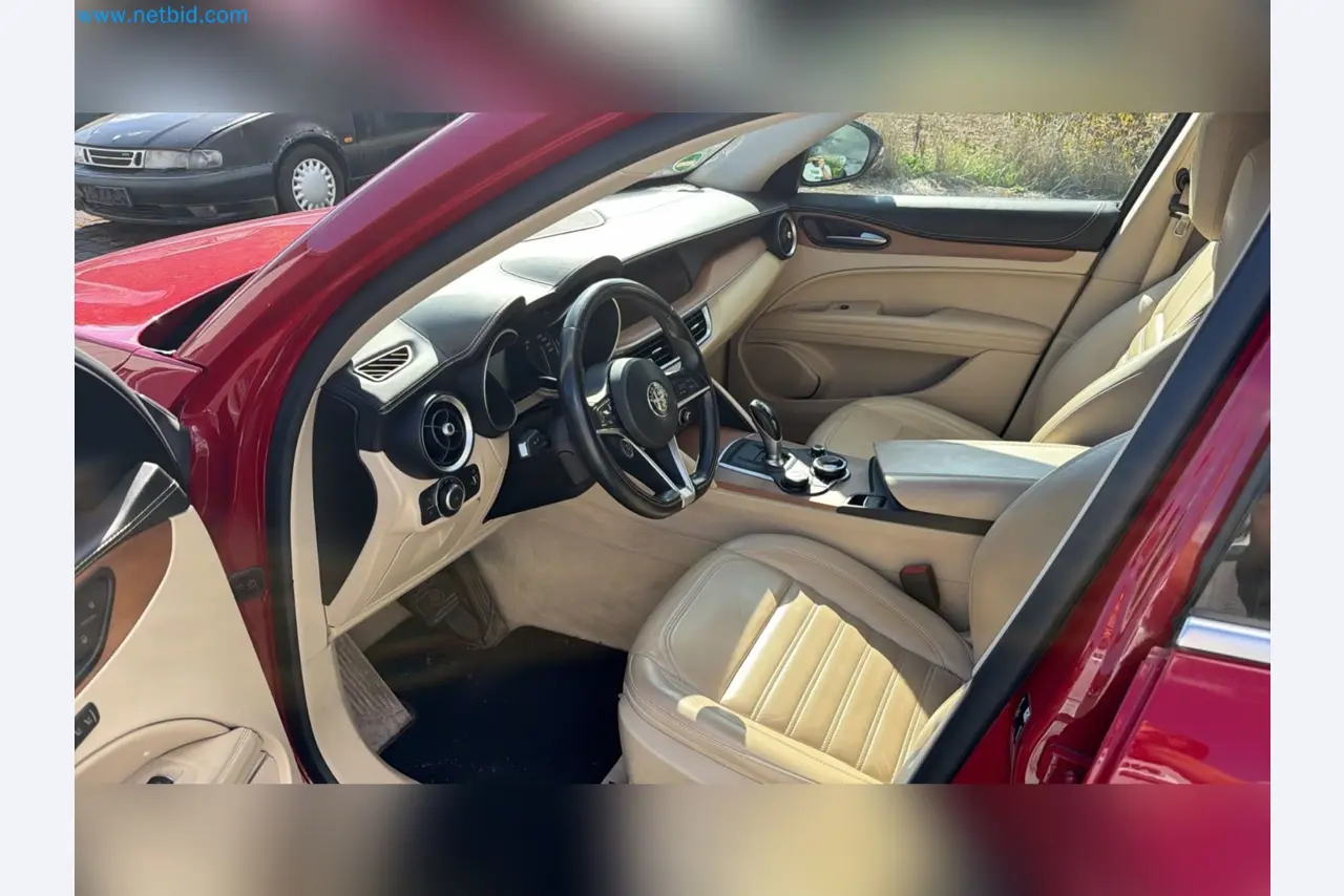 Passenger cars, electric cars, and automotive repair shop equipment at a Fiat dealership-10