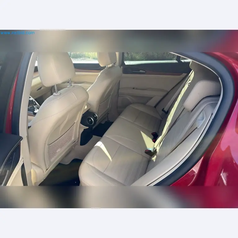 Passenger cars, electric cars, and automotive repair shop equipment at a Fiat dealership-11