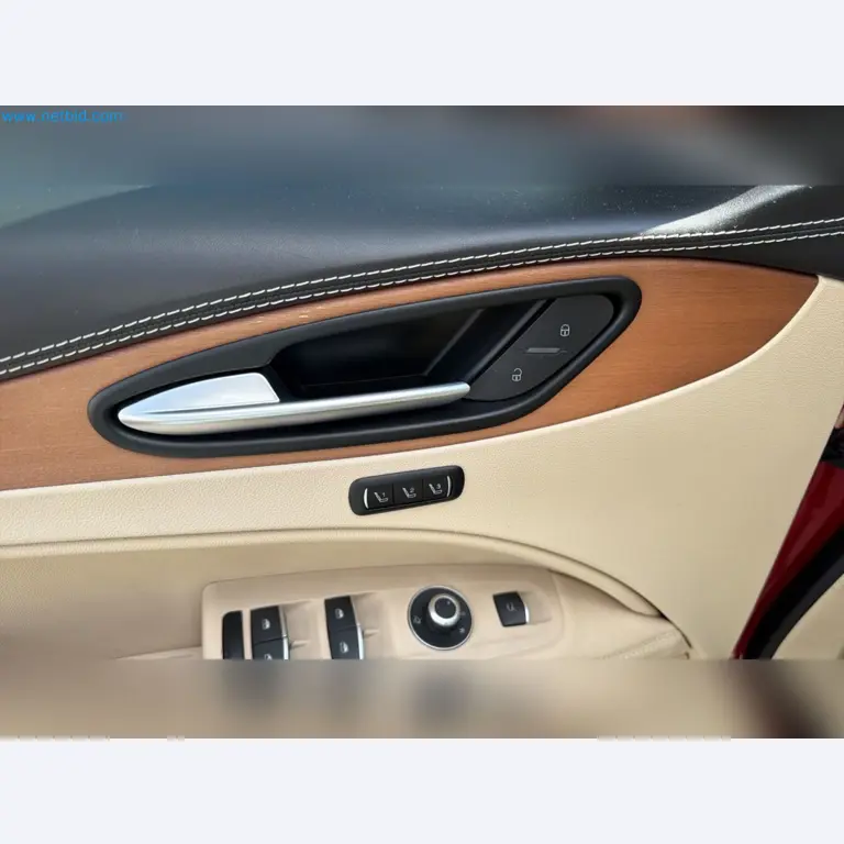 Passenger cars, electric cars, and automotive repair shop equipment at a Fiat dealership-12