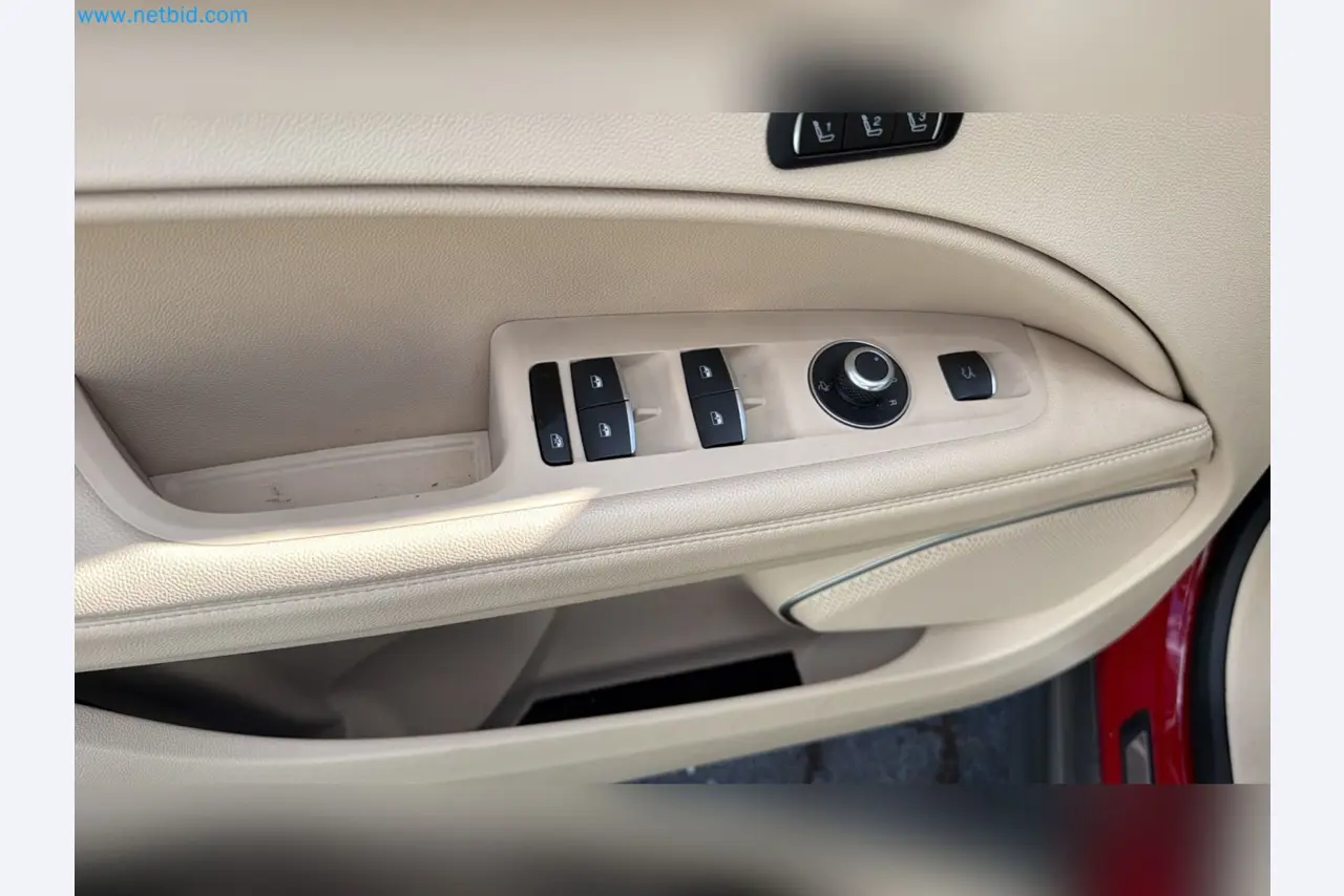 Passenger cars, electric cars, and automotive repair shop equipment at a Fiat dealership-13